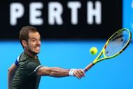 PERTH, AUSTRALIA - JANUARY 07:  Richard Gasquet of France plays a backhand to Jack Sock of the United States in the men's singles match during the 2017 Hopman Cup Final at Perth Arena on January 7, 2017 in Perth, Australia.  (Photo by Paul Kane/Getty Images)